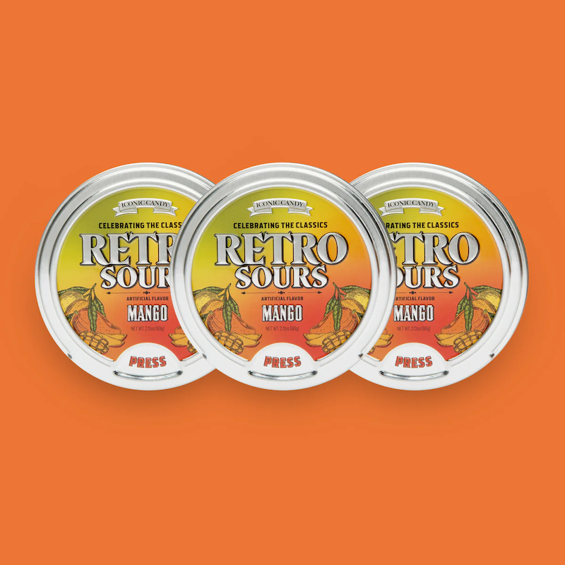 Three containers of Retro Sours Mango hard candies.