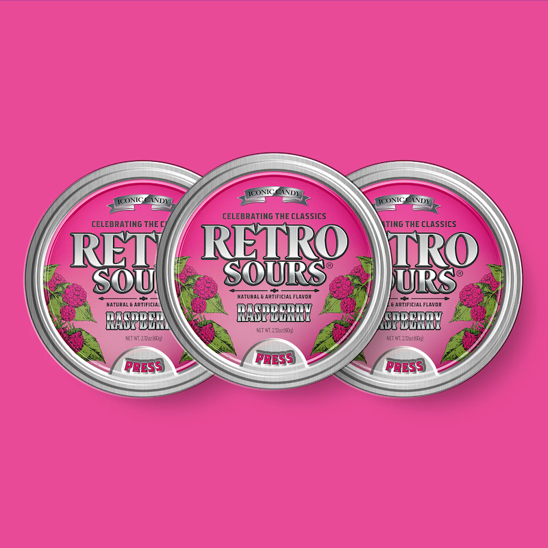Three tins of Retro Sours Raspberry hard candies.
