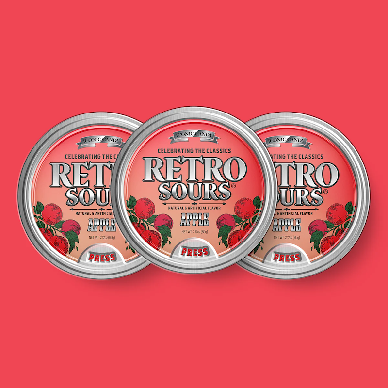 Three tins of Retro Sours Red Apple hard candies.